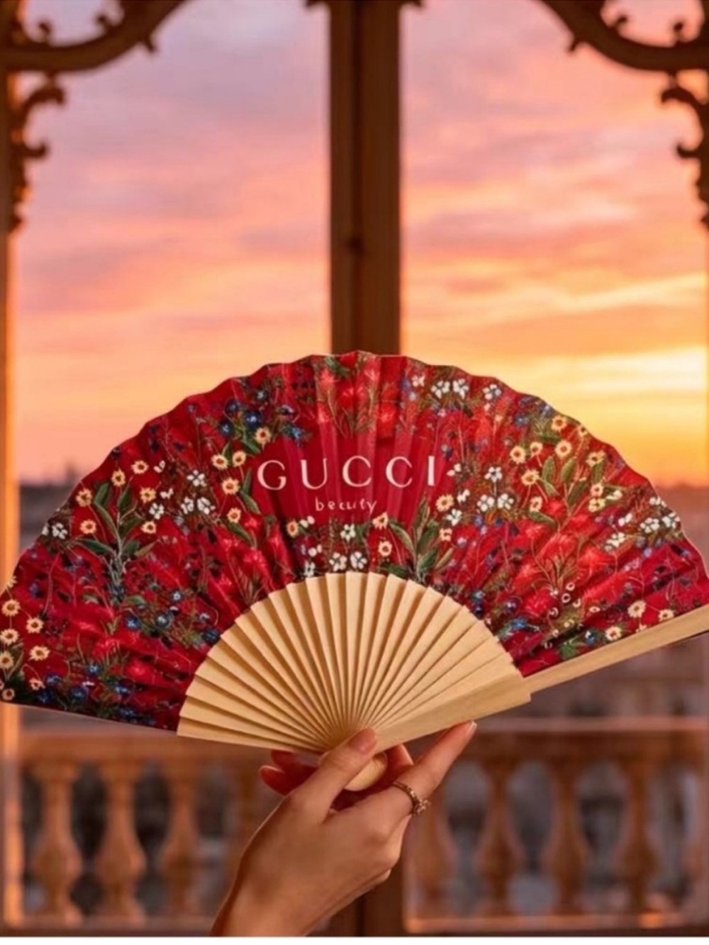 Gucci beauty holding fan